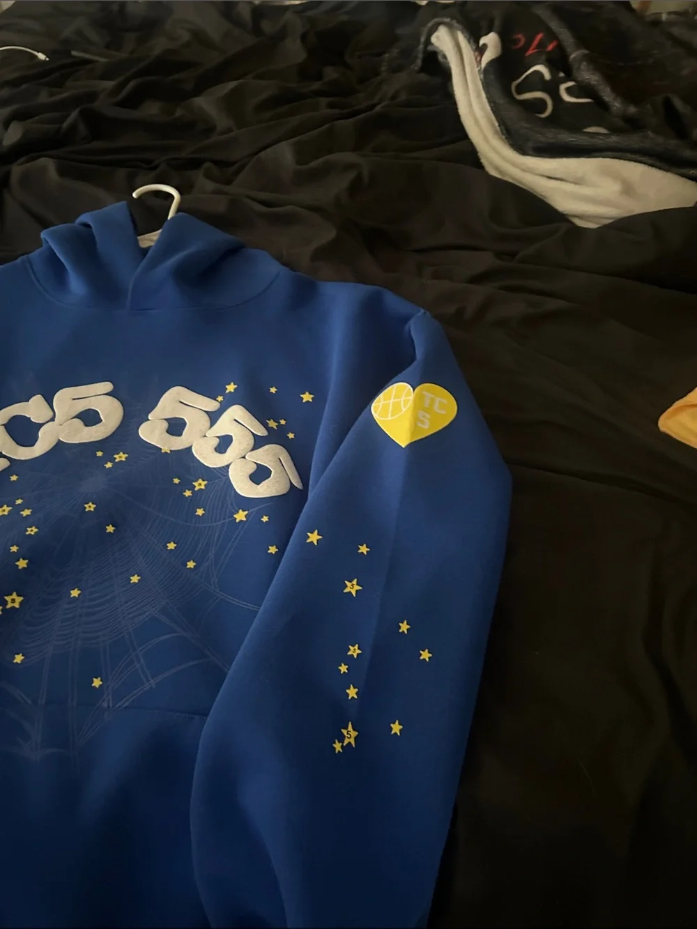 Blue Graphic Hoodie with White Logo and Yellow Star Details